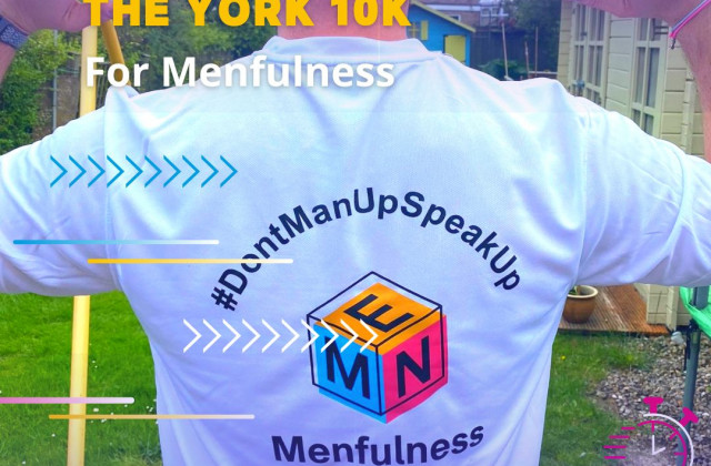 Person wearing a white t-shirt.  On the back, there is a logo for Menfulness charity, and information about the York 10k race.